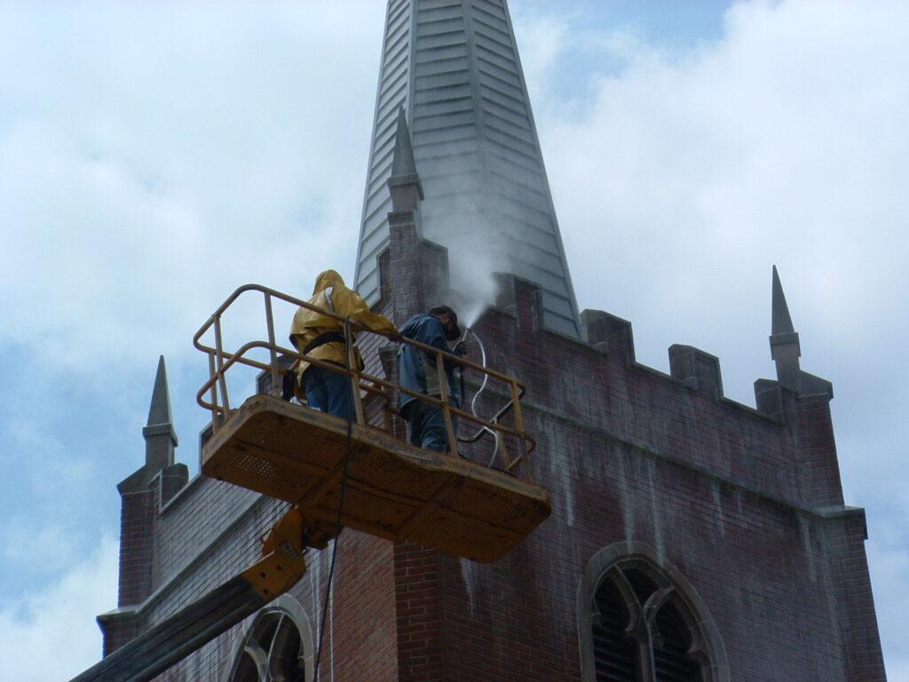 High-reach lift being used to restore a historic church façade.