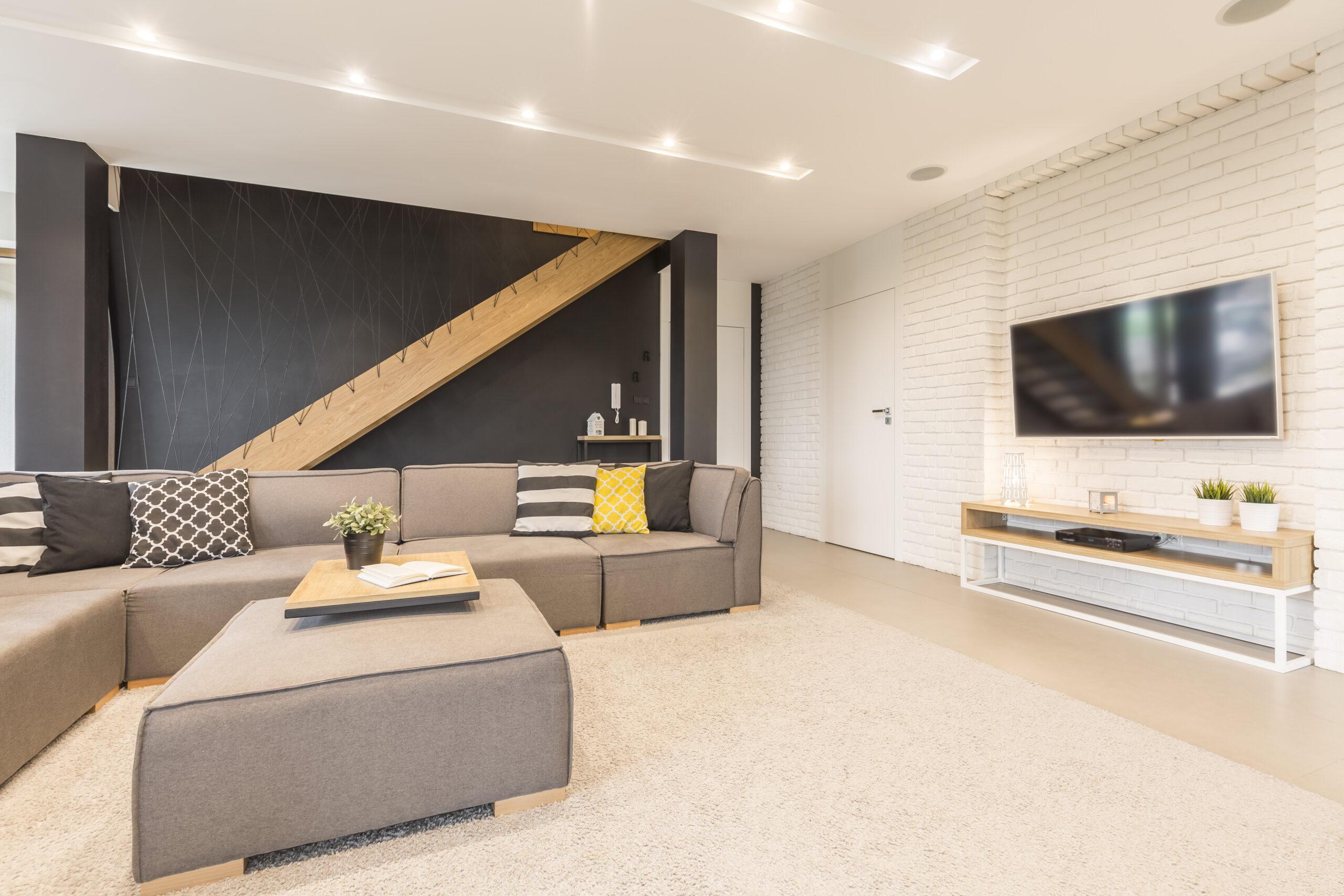Contemporary basement with recessed lighting.